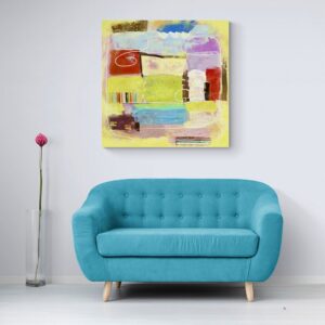 A big canvas print is on the wall above the turquois modern couch.