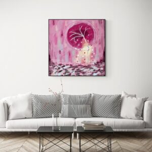 A big Pink Wabi Sabi canvas print is on the wall above earthy sophisticated grayish sofa.