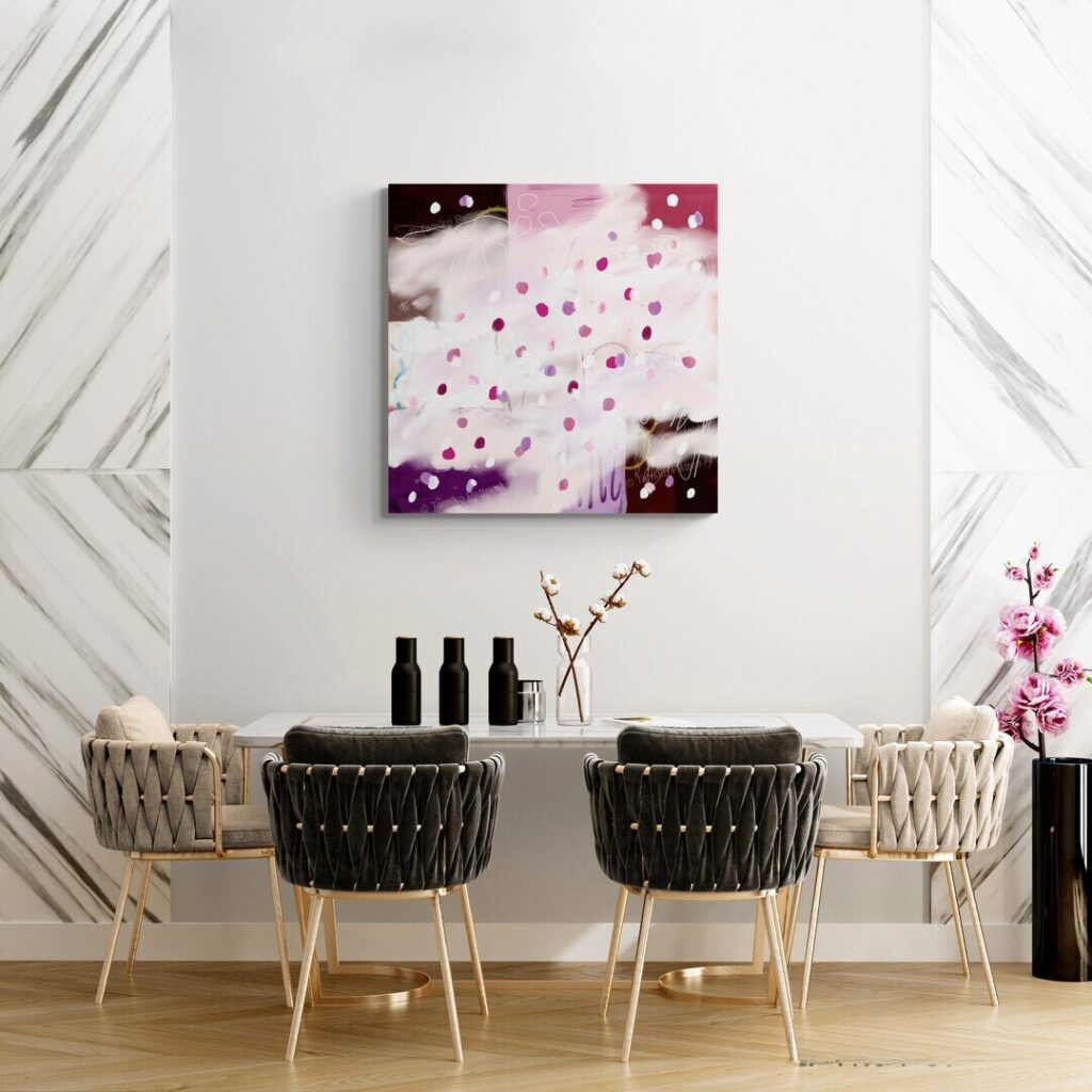 A canvas print of Sakura is on the wall above modern beauty table with pink flowers next to it.