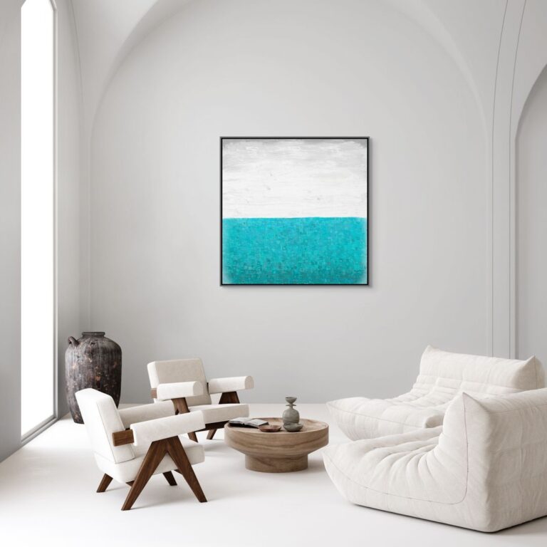 A big canvas print in a gray floating frame is on the big white wall where coffee table and chairs are white. It's a Greek style living room.