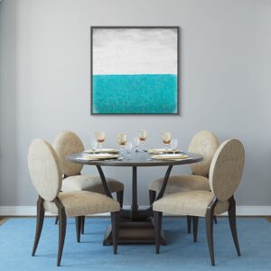 A big canvas print in a gray floating frame is on the fancy dining room.