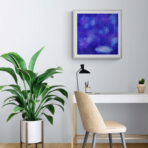 A medium size of paper print of Blue Rain is in the glass frame. It is on the wall above the modern desk.
