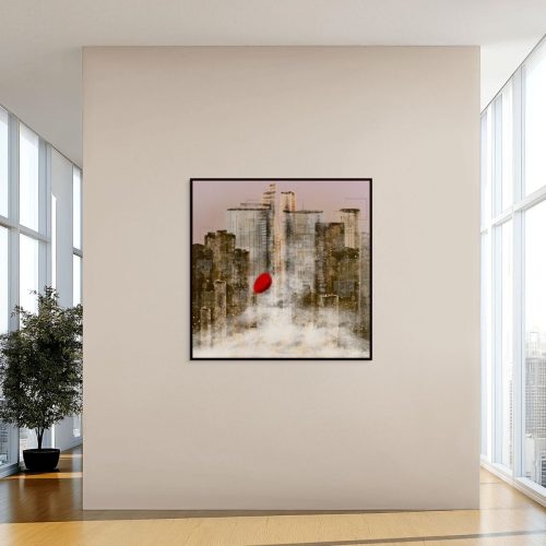 A big canvas print in a black floating frame is on the big wall in a tall building.